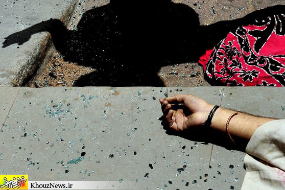 SUICIDE: The body of Narasimha Murthy, 28, lay on the sidewalk in Bangalore, India, on Thursday. Ms. Murthy jumped from the 21st floor of the Visvesvaraya Tower. (Jagadeesh NV/European Pressphoto Agency)