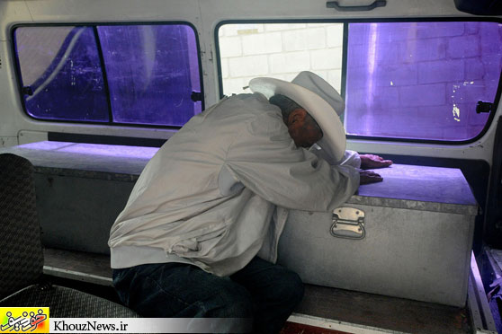 SON’S DEATH: A man cried over the coffin of his son, who is suspected to have died after drinking adulterated alcohol, in Tegucigalpa, Honduras, Thursday. Authorities are investigating whether people died from drinking alcohol spiked with methanol in the city of Siguatepeque. (Orlando Sierra/AFP/Getty Images)